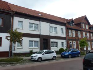 a white car parked in front of a house at Ferienzimmer Wenzel in Hasselfelde