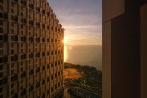 a view of the ocean from a tall building at Mandala Cham Bay Mui Ne in Ấp Thiẹn Ái