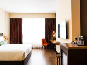 Postel nebo postele na pokoji v ubytování Starus Hotel Bukit Bintang