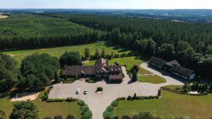 an aerial view of a large house in a field at Hotel Cykada in Wielki Głęboczek