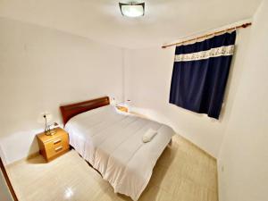 En eller flere senger på et rom på Apartamento Vacacional Acapulco Iv 2 Ref 022