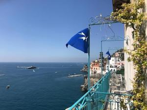 a view of the amalfi coast from a balcony with a helicopter at Casa Gargano Ravello Amalfi Coast in Amalfi