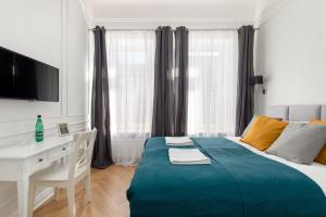 Posteľ alebo postele v izbe v ubytovaní Lwowska 9 - Cozy & Comfortable Studio by Noclegi Renters