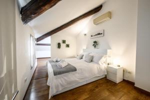Letto o letti in una camera di Buenos Aires' Nest - 10 minutes from Duomo with terrace