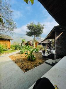 a view of a garden from a house at Anh Duc Homestay in Sapa