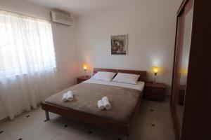 Postel nebo postele na pokoji v ubytování Studios & Rooms Fiesta