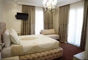 Letto o letti in una camera di Hotel Eiffel