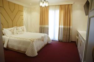 Letto o letti in una camera di Hotel Eiffel