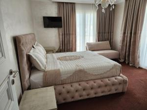 Letto o letti in una camera di Hotel Eiffel