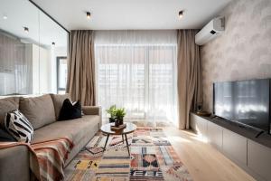 Et tv og/eller underholdning på Tribal 1BR in Aviatiei