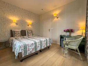 Voodi või voodid majutusasutuse Hotel Pavillon Du Zoute toas