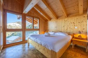 Voodi või voodid majutusasutuse Chalet Vansamis, breathtakinng views & sauna toas