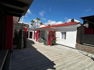 a house with a walkway between two buildings at Paradise Resort - FKK Swinger & Nudist Couples Only in Maspalomas