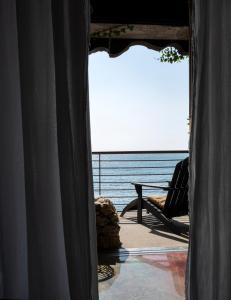 a room with a view of the ocean from a window at Eco del Mare in Lerici