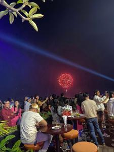 a group of people sitting at tables at a party at V V Hotel Battambang in Battambang +91 photos