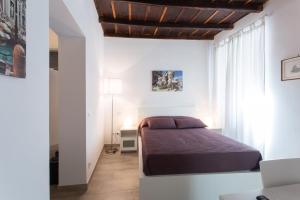 Giường trong phòng chung tại Domenichino Luxury Home