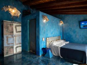 a blue bedroom with a bed in a room at Eco del Mare in Lerici +11 photos