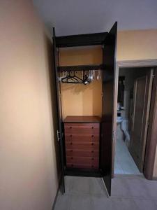 a room with a closet with a dresser and a bathroom at Mies de Estrada in Comillas