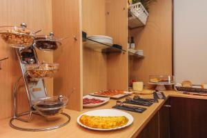 a kitchen with some food on a counter at Hotel Lauria in Tarragona