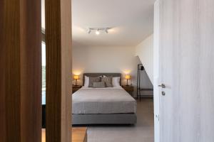 Postel nebo postele na pokoji v ubytování Villa Ligaria Pinnacle