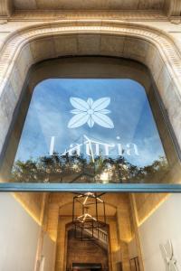 a window of a store with a flower on it at Hotel Lauria in Tarragona