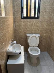 a bathroom with a toilet and a sink at Residence ABIS 