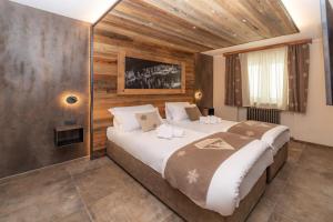 Postel nebo postele na pokoji v ubytování Avalanche - Alpine Boutique Hotel + 20 fotografií