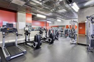 a gym with several treadmills and machines at East Village 1br w spa media room nr stadium SAN-37 in San Diego
