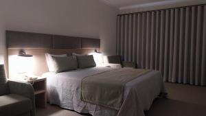 Cama ou camas em um quarto em Hotel Santa Maria