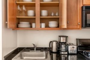 A kitchen or kitchenette at Fidi 1br w doorman wd nr south st seaport NYC-1306