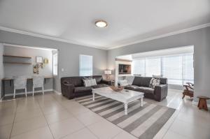 a living room with a couch and a coffee table at Apartment 6 in Yzerfontein