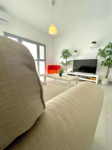 TV a/nebo společenská místnost v ubytování Sandy Beach Complex