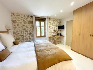 Postel nebo postele na pokoji v ubytování Barbarens Maison d'hotes + 22 fotografií