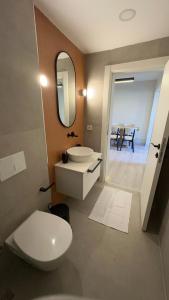 a bathroom with a toilet and a sink and a mirror at Super Stylish Studio & Bosphorus View in Ortaköy-8 in Istanbul