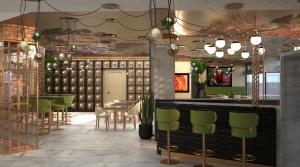 a restaurant with green chairs and a bar at INNSiDE by Meliá Tenerife Santa Cruz in Santa Cruz de Tenerife +24 photos