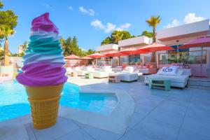 a giant ice cream cone in a pool at Wi-Ki-Woo Boutique Hotel in San Antonio