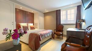 Voodi või voodid majutusasutuse Hotel Pavillon Du Zoute toas