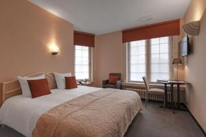 Voodi või voodid majutusasutuse Hotel Pavillon Du Zoute toas