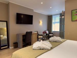 Voodi või voodid majutusasutuse Hotel Pavillon Du Zoute toas