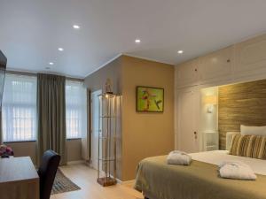 Voodi või voodid majutusasutuse Hotel Pavillon Du Zoute toas