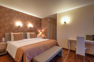 Voodi või voodid majutusasutuse Hotel Pavillon Du Zoute toas
