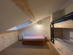 a bedroom with two bunk beds and a window at Appartement Corrençon-en-Vercors, 3 pièces, 8 personnes - FR-1-761-3 in Corrençon-en-Vercors