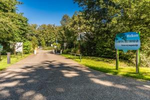 a sign on the side of a road at Camping het Bosbad in Emmeloord +39 photos