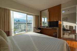 Giường trong phòng chung tại Kantary Hills Hotel, Chiang Mai