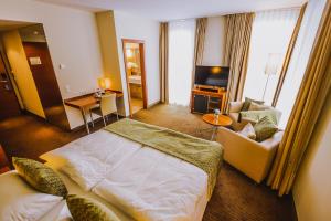 Giường trong phòng chung tại Seehotel Süd by S4Y