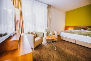 Giường trong phòng chung tại Seehotel Süd by S4Y
