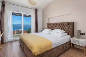 Ένα ή περισσότερα κρεβάτια σε δωμάτιο στο Villa Antares +51 φωτογραφίες