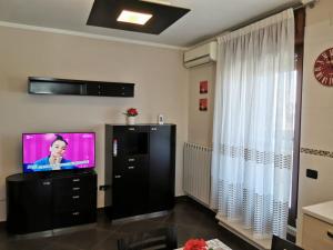 A television and/or entertainment centre at NSM Casa di Fulmine attico con box privato
