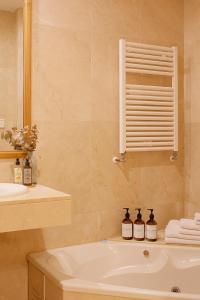 a bathroom with a sink and a mirror at Casco Histórico-Catedral in Oviedo