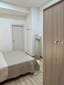 Postel nebo postele na pokoji v ubytování Antico Borgo Rooms
